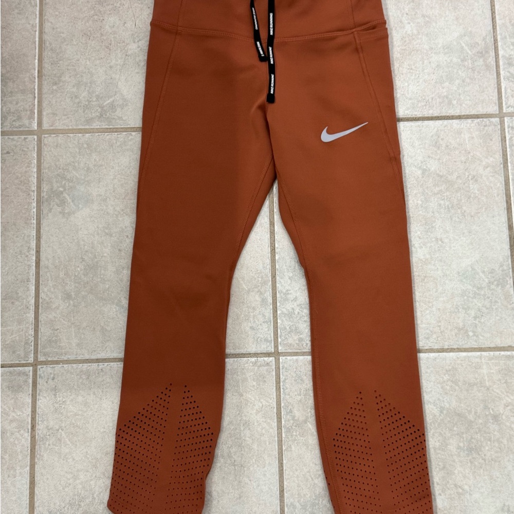 Nike Women’s Burnt Orange Leggings with Silver Logo
